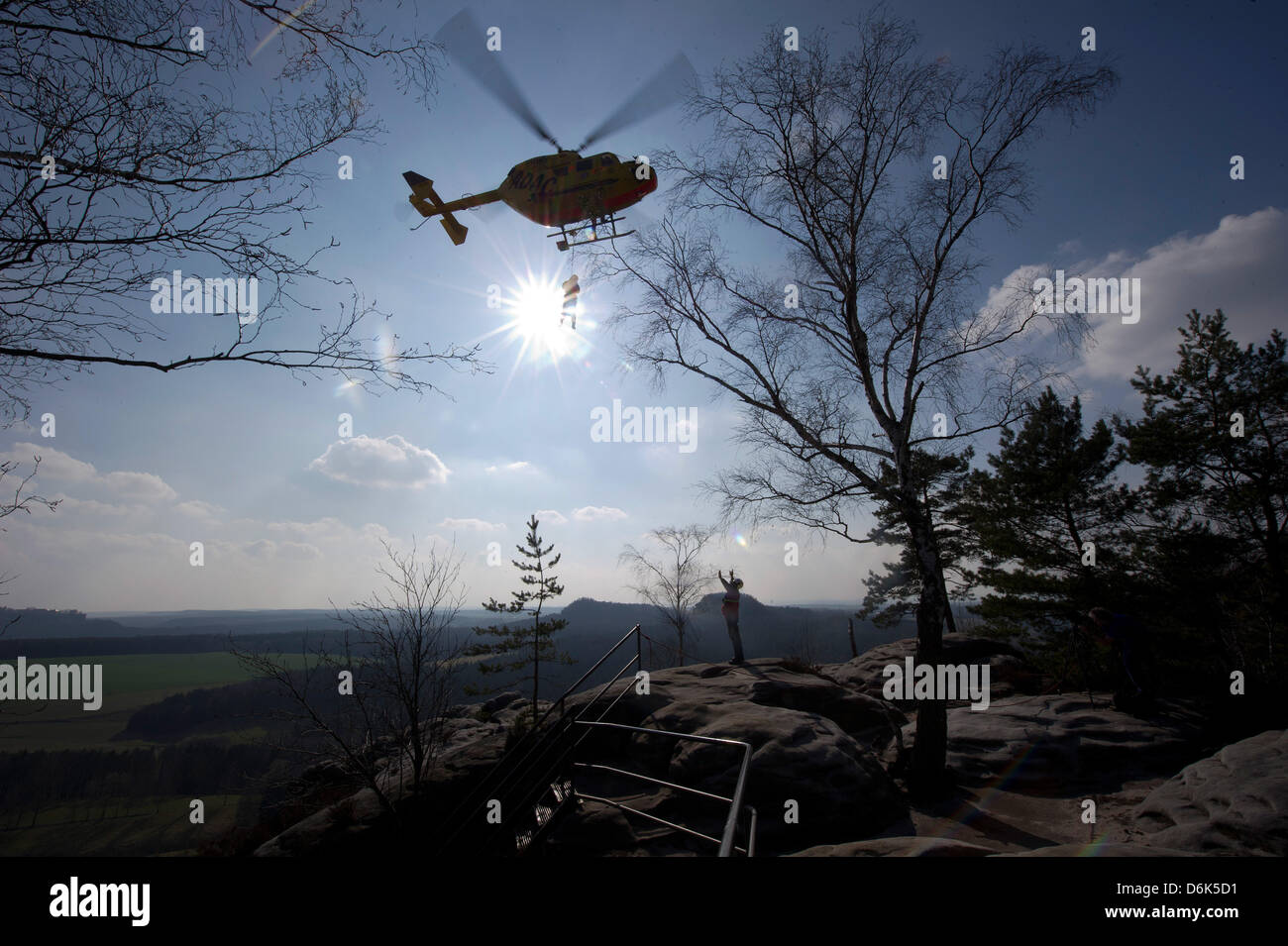 Rescue forces aboard helicopter 'Christoph 62' during a joint mountain rescue service manoeuvre of German automobile club ADAC and German Red Cross DRK division Saxony in Weissig, Germany, 23 March 2012. Photo: Arno Burgi Stock Photo