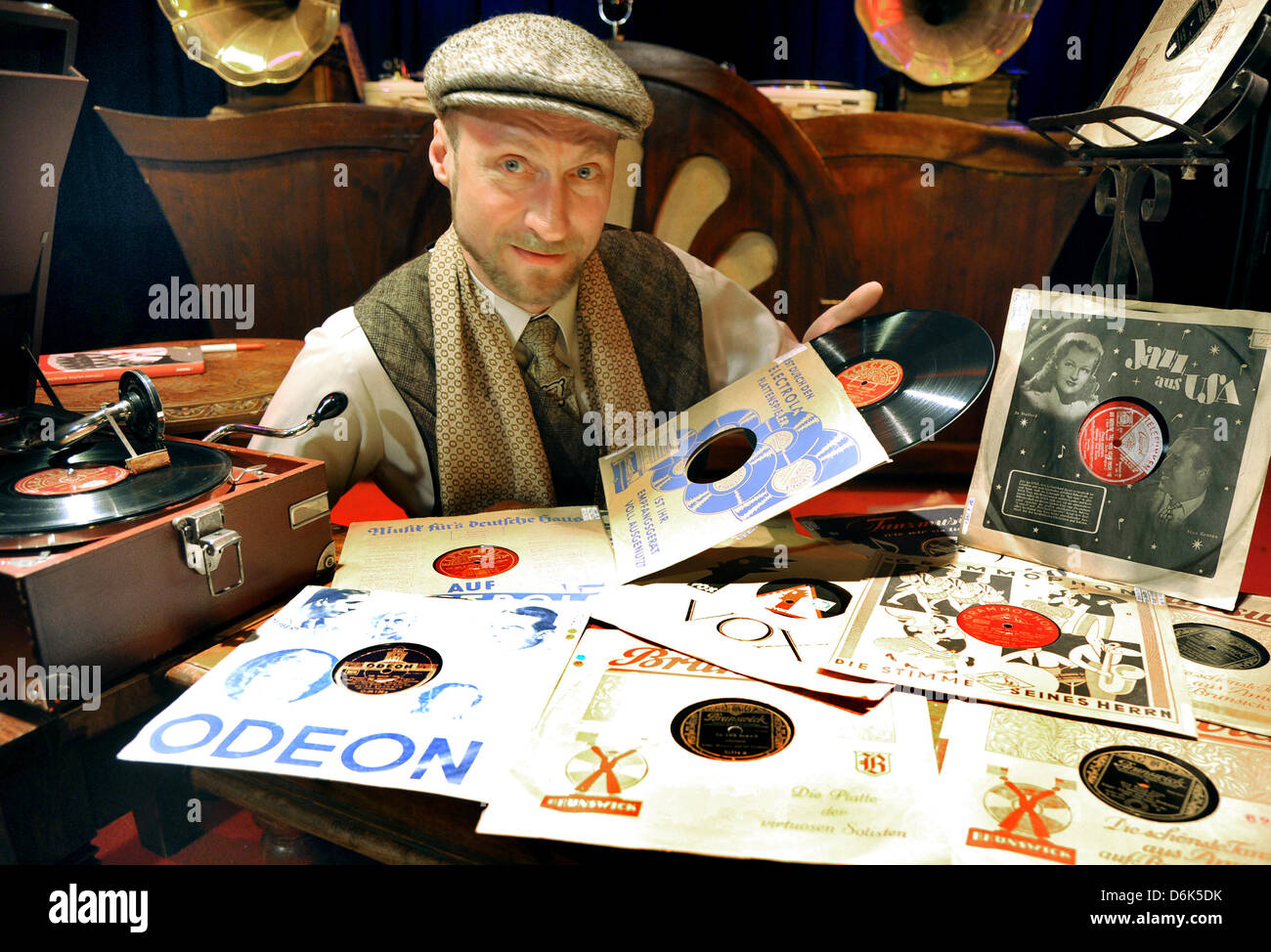Berlin-based discjockey and gramophone records collector Stephan Wuthe poses with some of his records and a gramophone in Leipzig, Germany, 17 March 2012. Swing music and records have experienced a renaissance and become en vogue again. Photo: Waltraud Grubitzsch Stock Photo