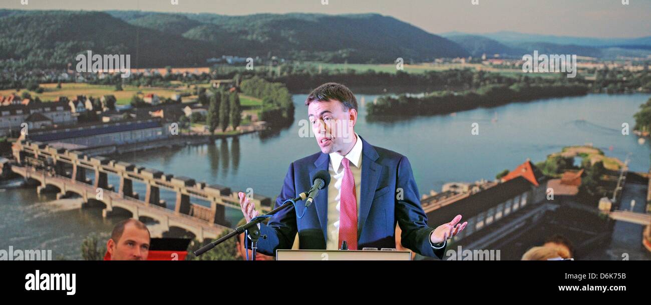 Minister of Economy of Baden-Wuerttemberg, Nils Schmid, speaks in front of a picture of the hydroelectric power station Augst-Whylen in Grenzach, Germany, 30 August 2012. The power station turned 100 this year. Photo: PATRICK SEEGER Stock Photo