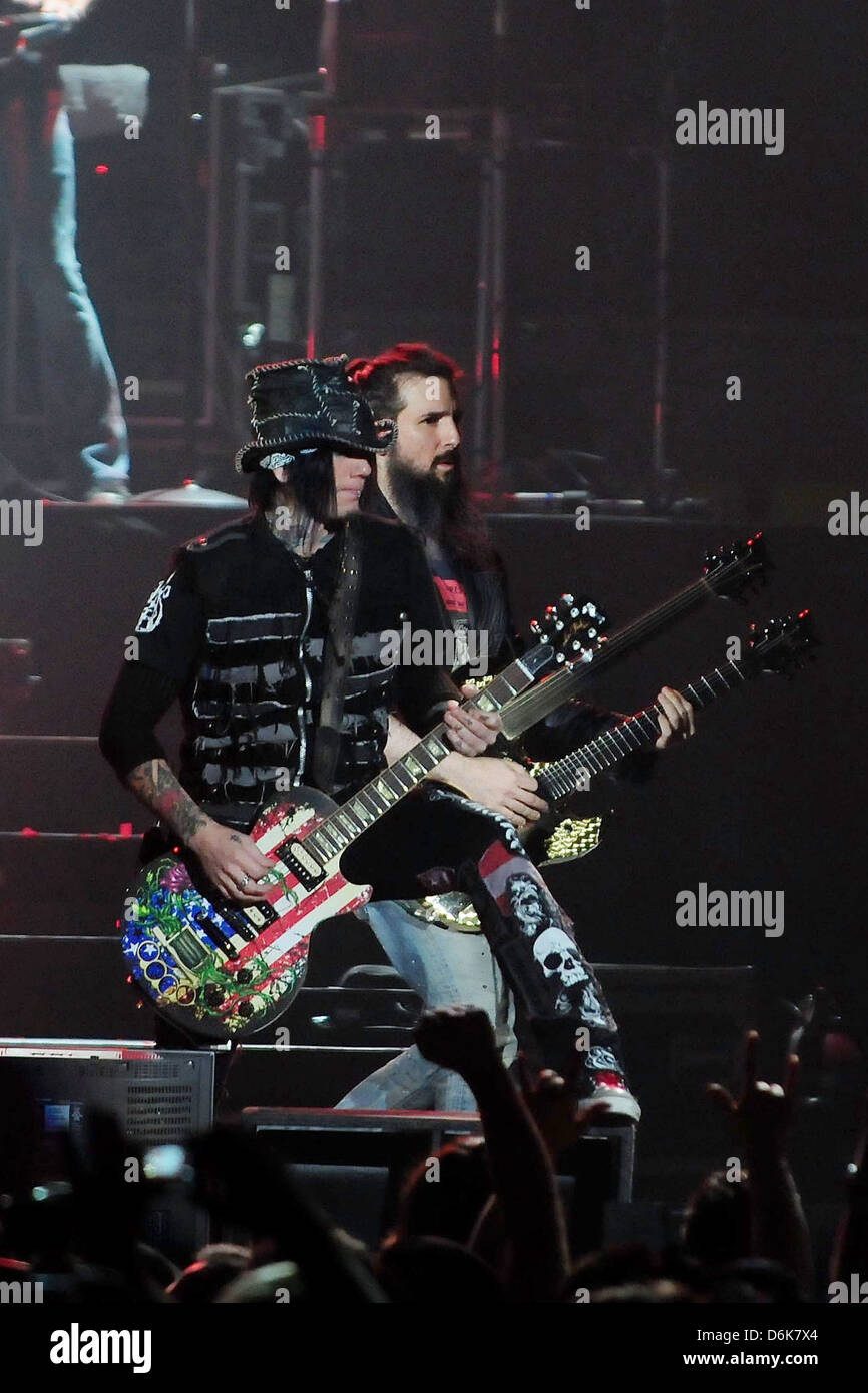 Ron 'Bumblefoot' Thal and Guitarist/ songwriter Dj Ashba of Guns N' Roses performs at the American Airlines Arena during his Stock Photo