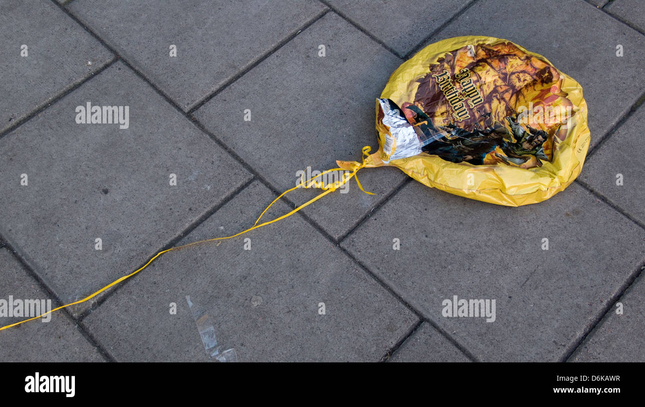 Deflated birthday balloon on pavement, Brighton, UK Stock Photo Alamy