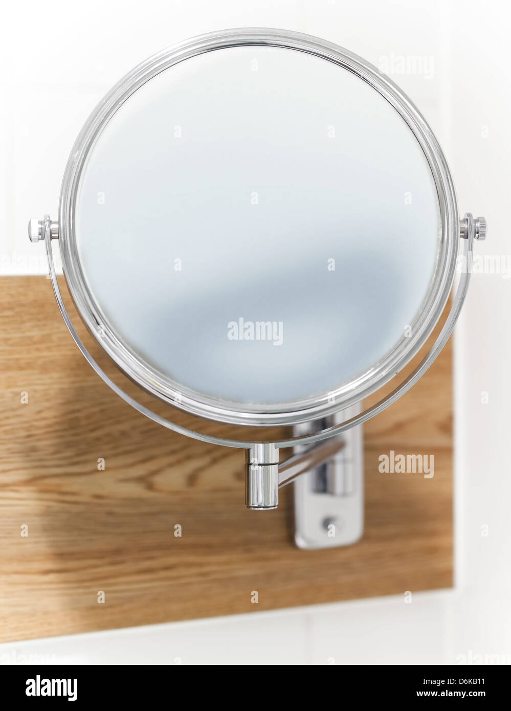 Round wall mirror for the bath. Close-up photo with selective focus Stock Photo - Alamy