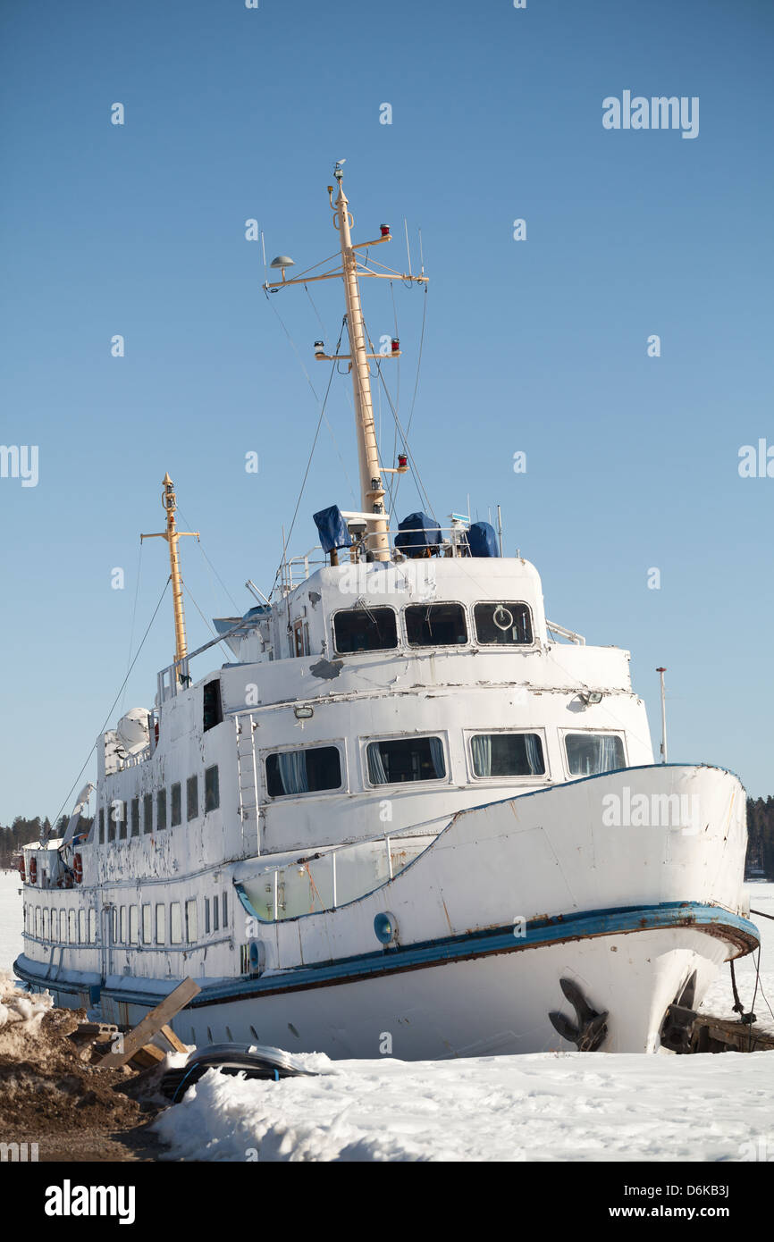 Moored small white passenger ship on the coast of Saimaa lake, Finland Stock Photo
