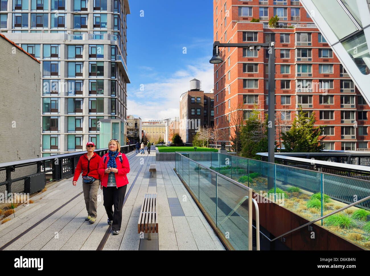 Pedestrians stroll atop the High Line April 13, 2013 in New York City, USA. Stock Photo