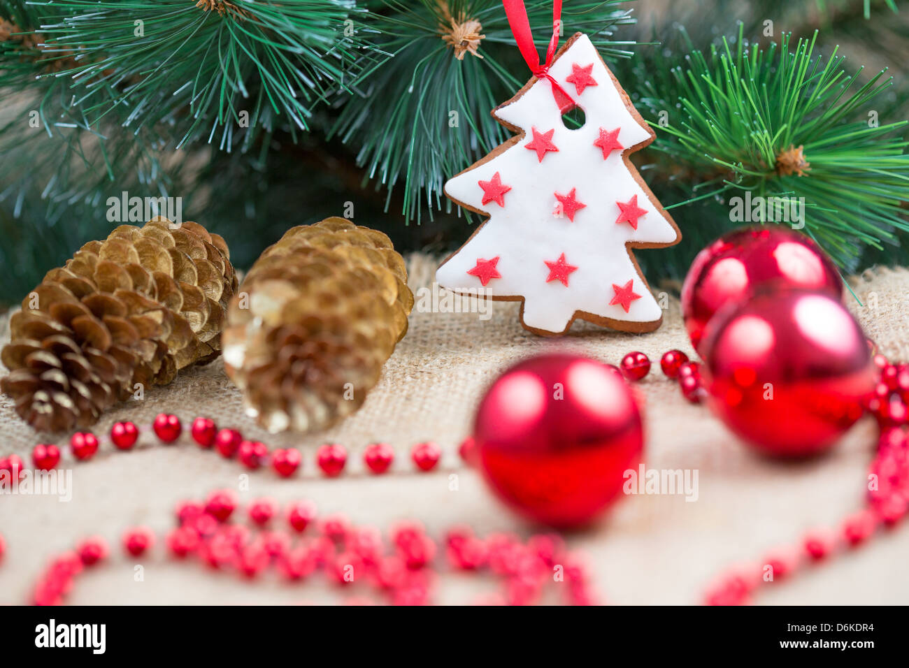 Christmas tree with baubles and cake Stock Photo