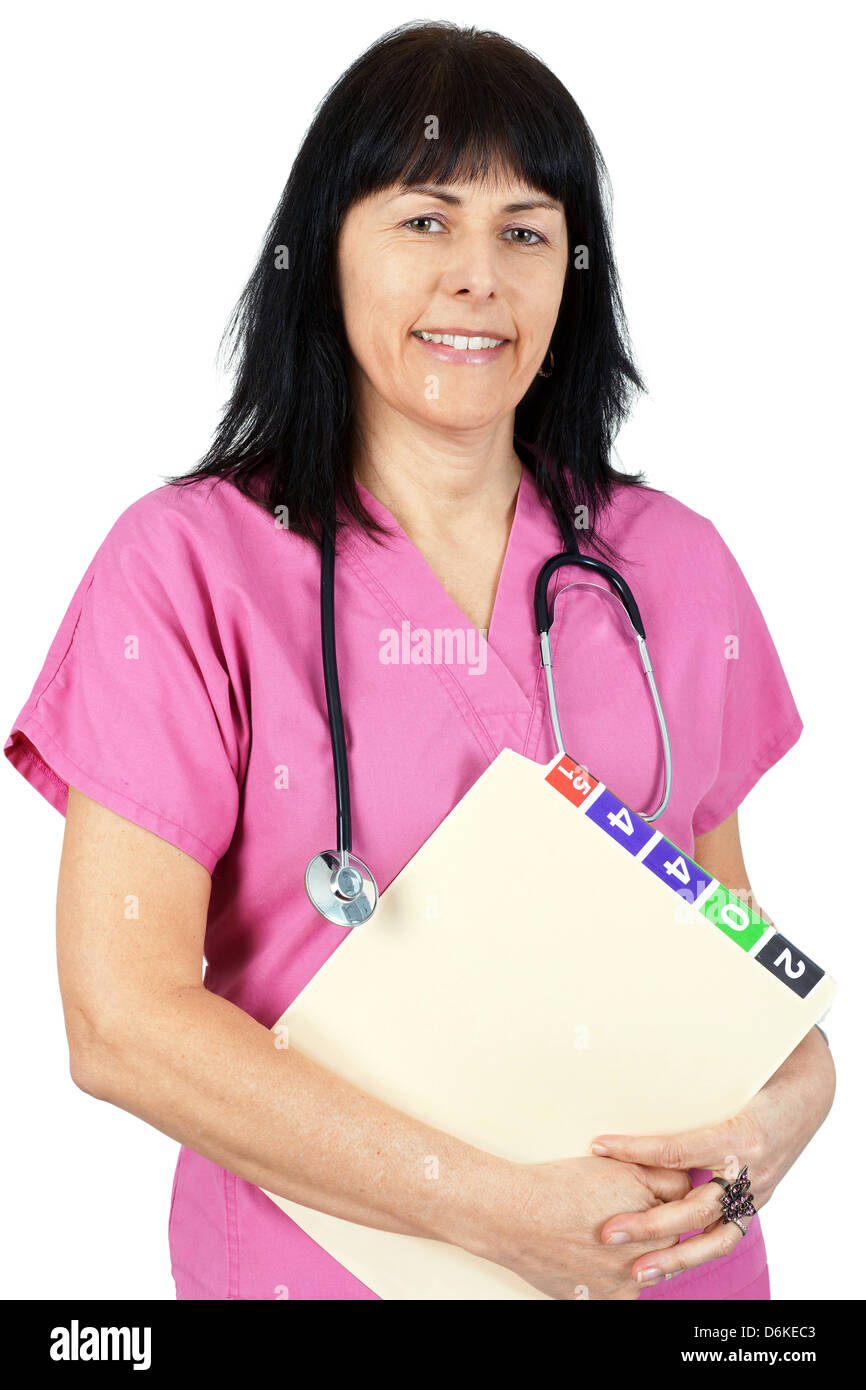 Friendly female doctor or nurse in pink isolated on white. Stock Photo