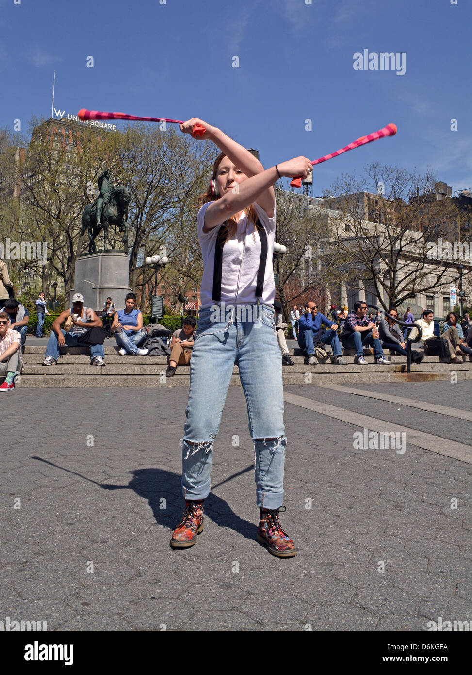 Young lady performing POI performance art in Union Square Park in New York City. Stock Photo