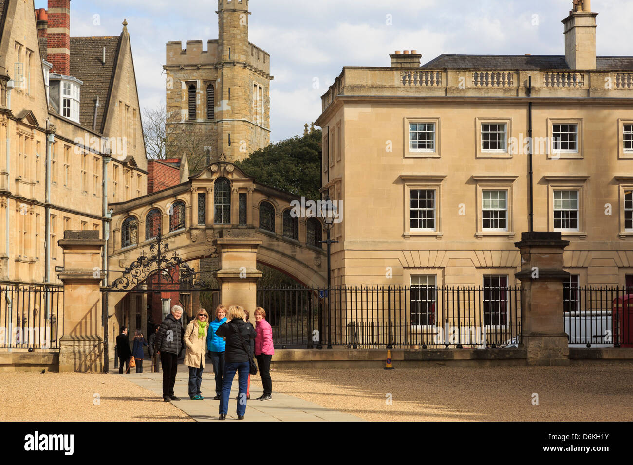 Tourists being photographed in front of the Bridge of Sighs and Hertford College in Oxford England UK Britain Stock Photo