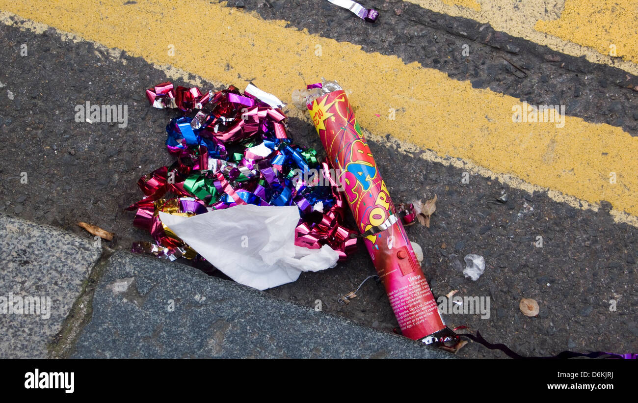 Litter in gutter, party poppers, Brighton, UK Stock Photo