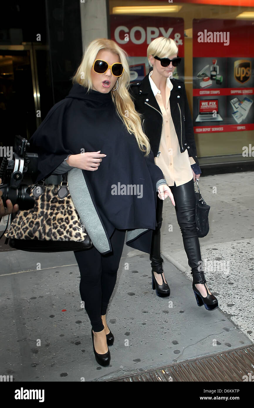 Jessica Simpson and Ashlee Simpson Jessica Simpson all covered up as she leaves Bergdorf Goodman with her sister New York City, Stock Photo