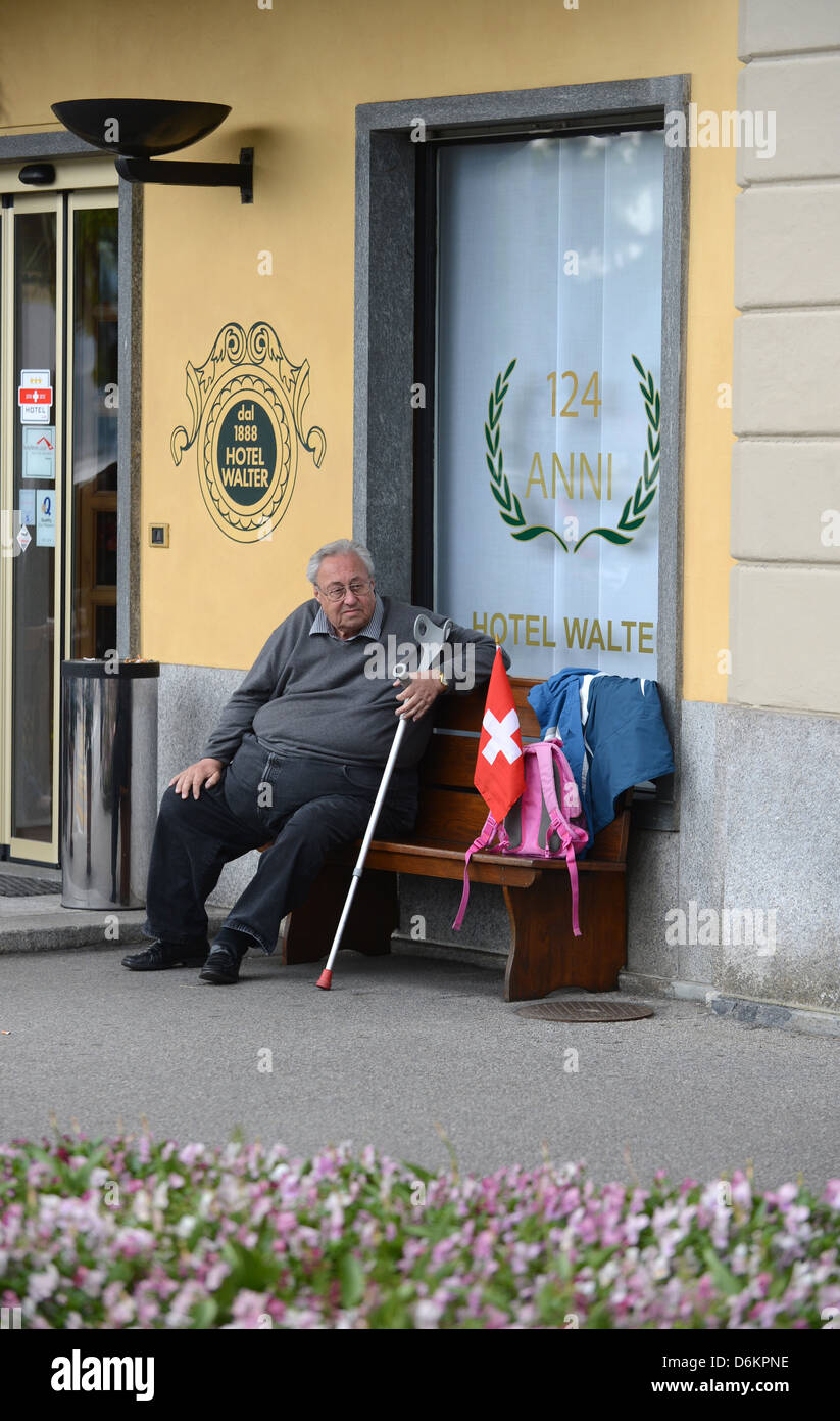 Lugano, Switzerland, a man pauses before Walter Hotel in Lugano Stock Photo