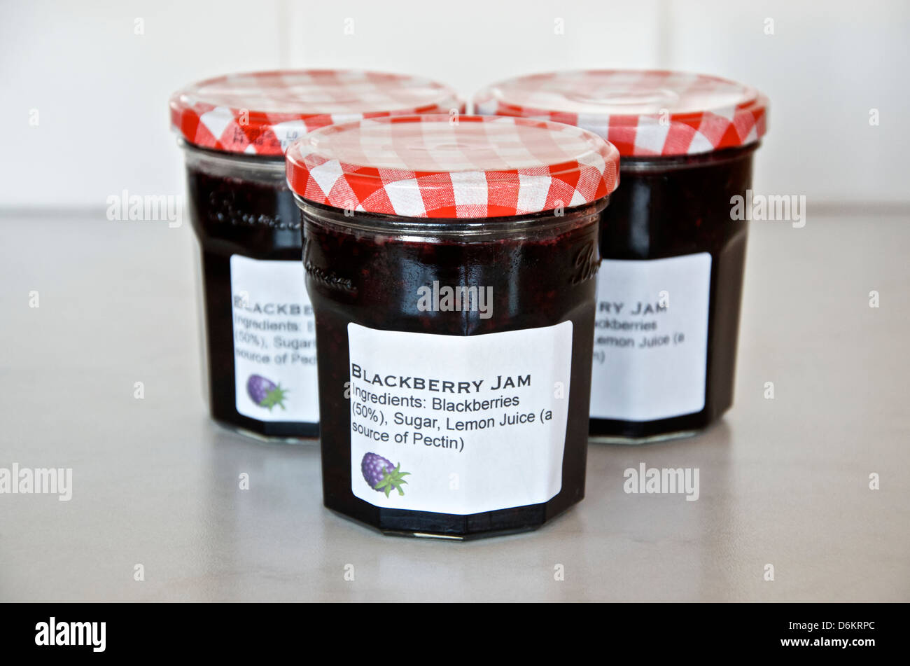 Making Jam: Step10/10, filled and sealed jars with labels Stock Photo