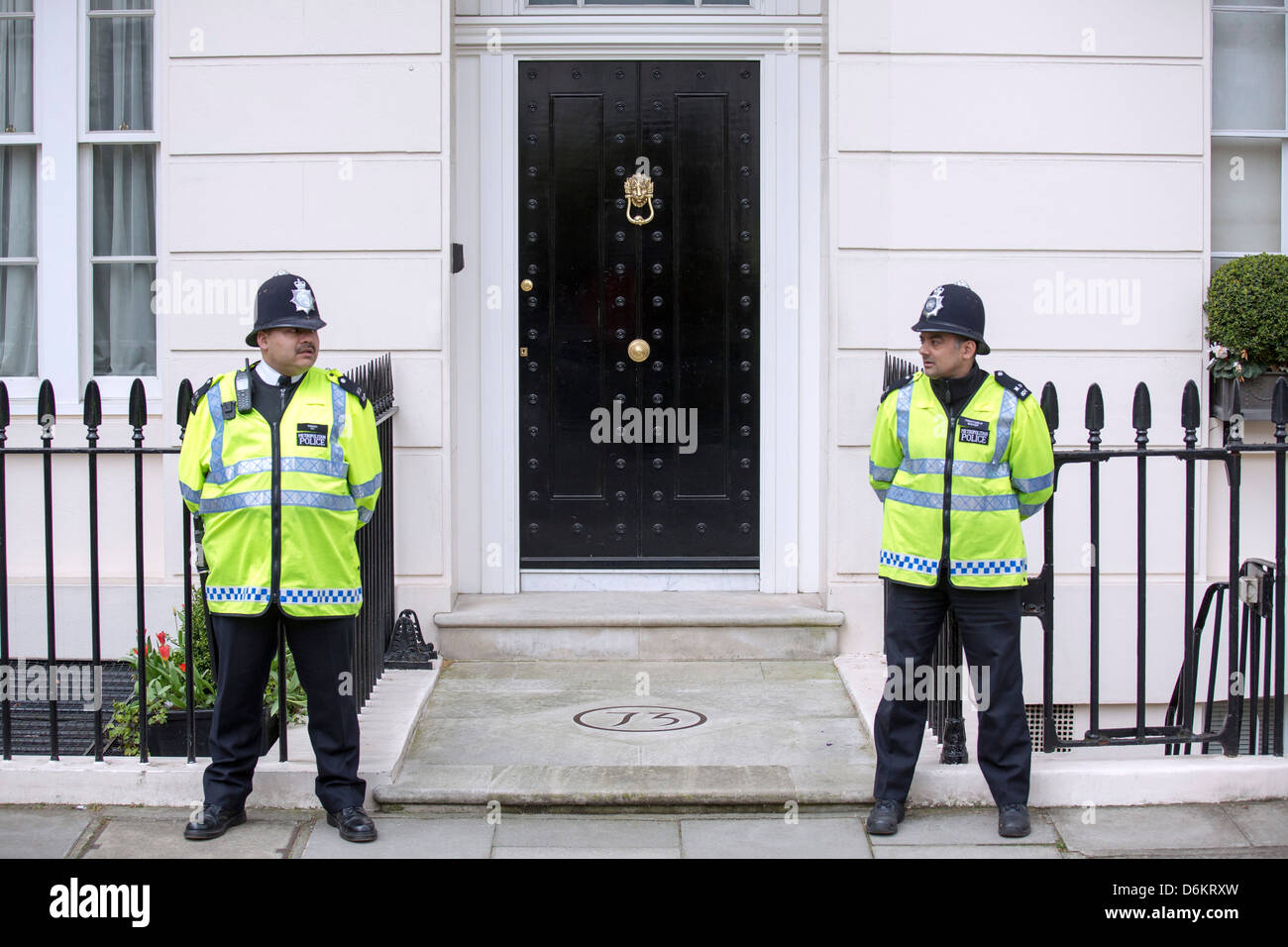 Two policemen guarding home in London Stock Photo