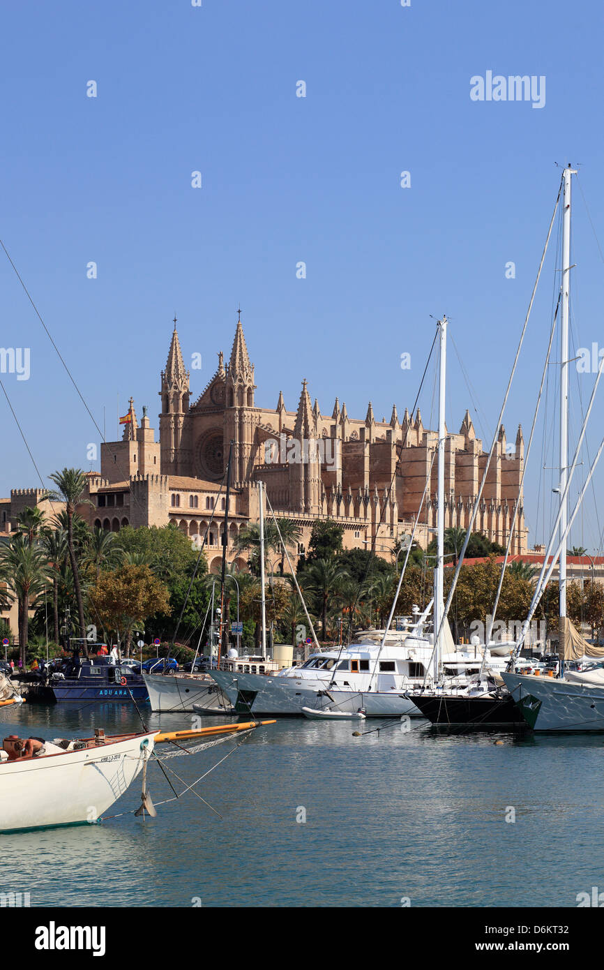Palma, Spain, sailing ships in the port of Palma de Mallorca in the background the Cathedral La Seu Stock Photo