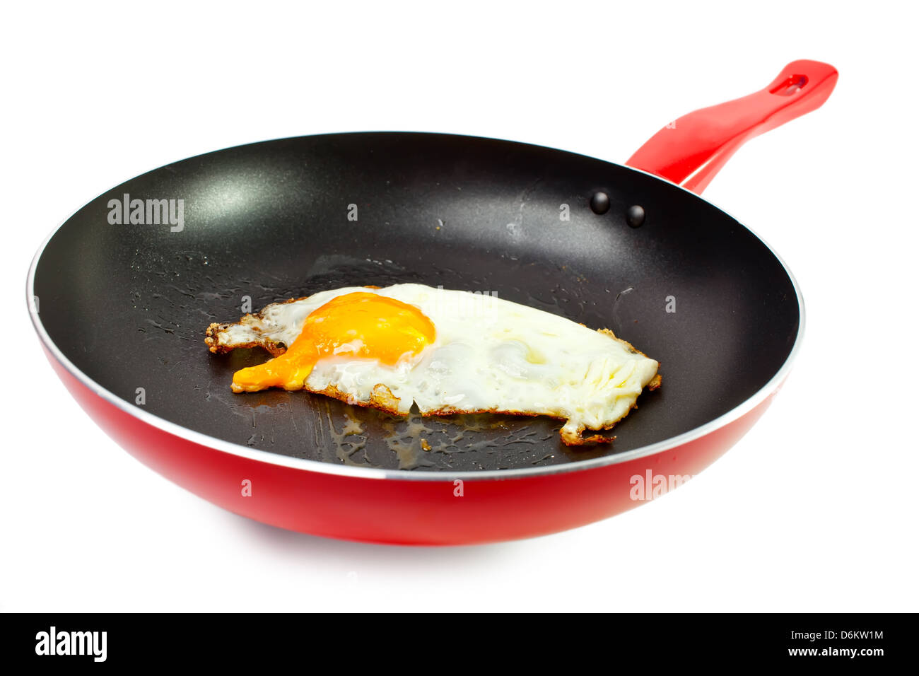 red frying pan with fried egg Stock Photo