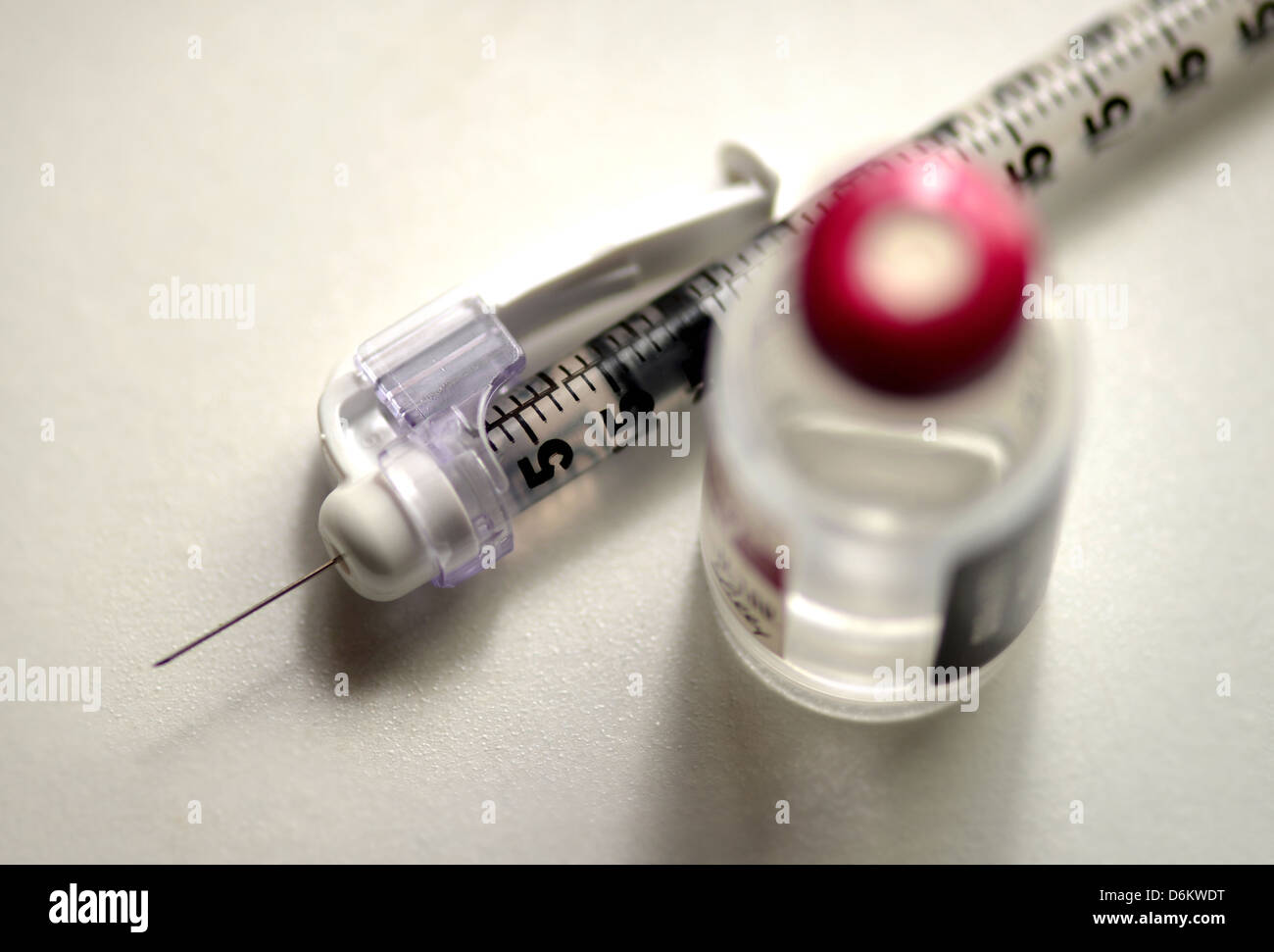 A syringe and insulin, which is used to treat diabetes. Stock Photo