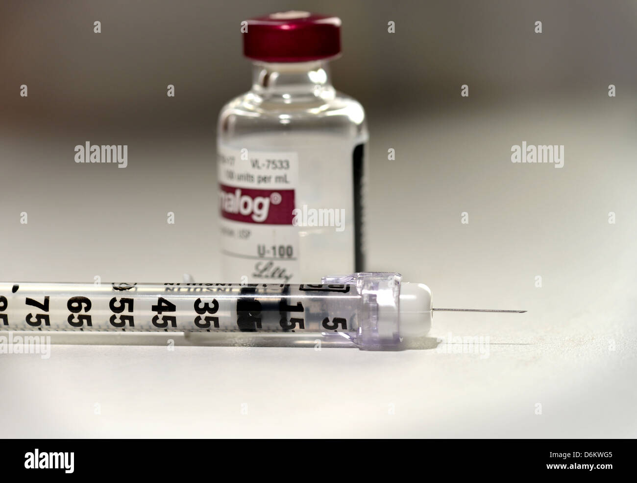 A syringe and insulin, which is used to treat diabetes. Stock Photo