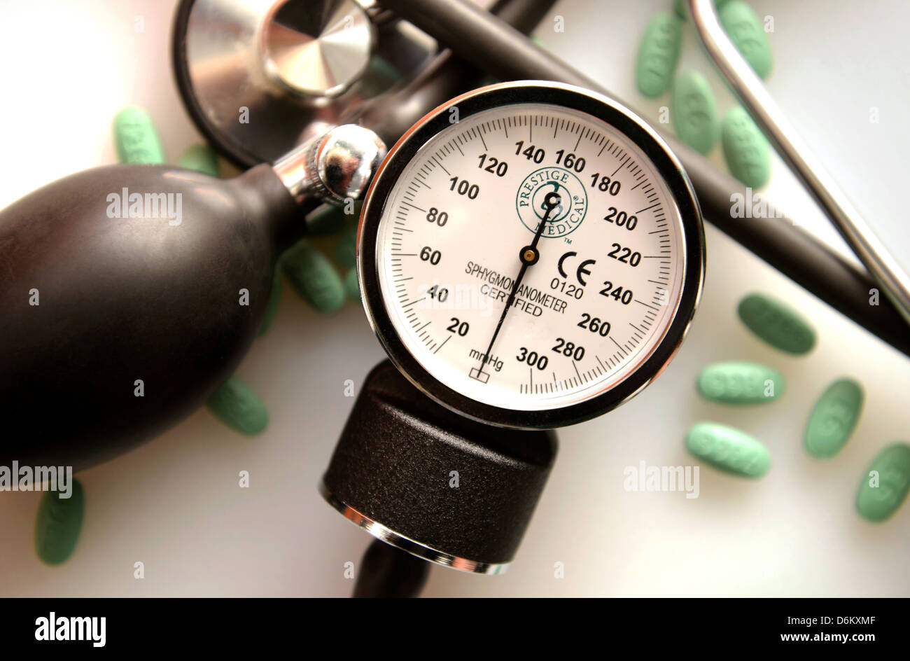A blood pressure cuff, or sphygmomanometer, a stethoscope and Losartan 100 mg tablets, used to treat hypertension. Stock Photo