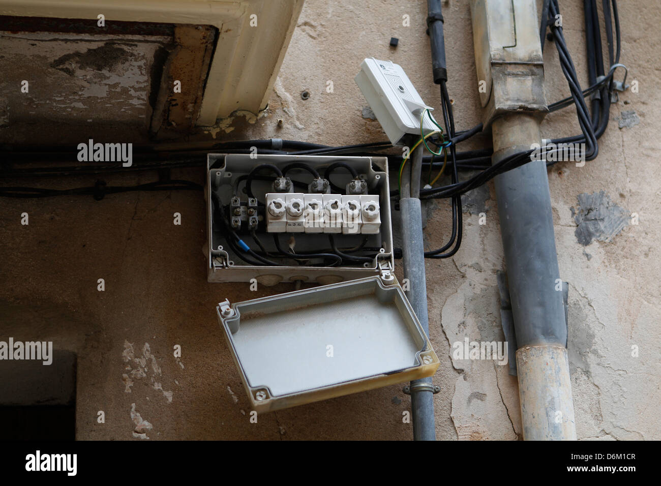 Old electric wires are seen on a building facade Stock Photo Alamy
