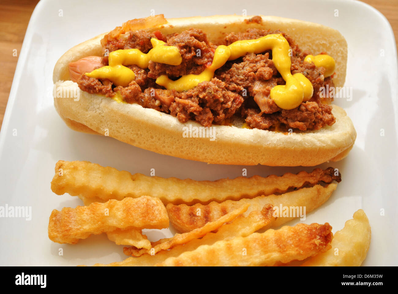 Chili Dog with Mustard and Fries Stock Photo Alamy