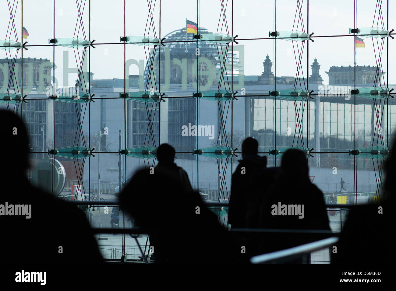 Berlin, Germany, passersby in central station, in the background of the Reichstag Stock Photo