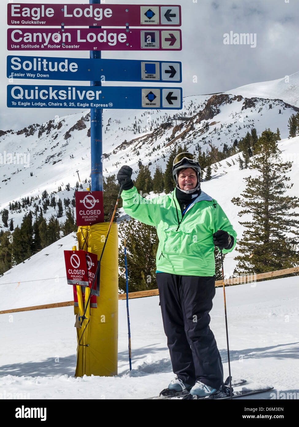 Woman wearing plus size ski wear skiing at Mammoth Mountain in California. Stock Photo