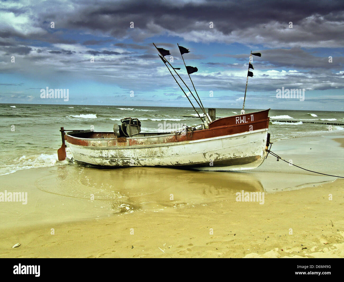 a fishing boat on the beach of the Baltic coast Stock Photo - Alamy