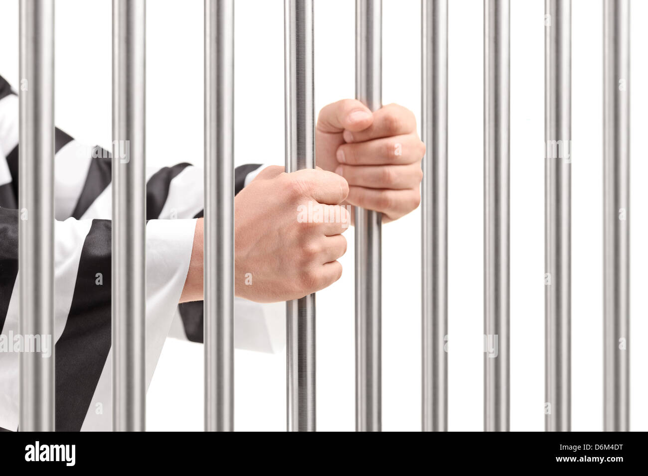 Male hands holding prison bars Stock Photo