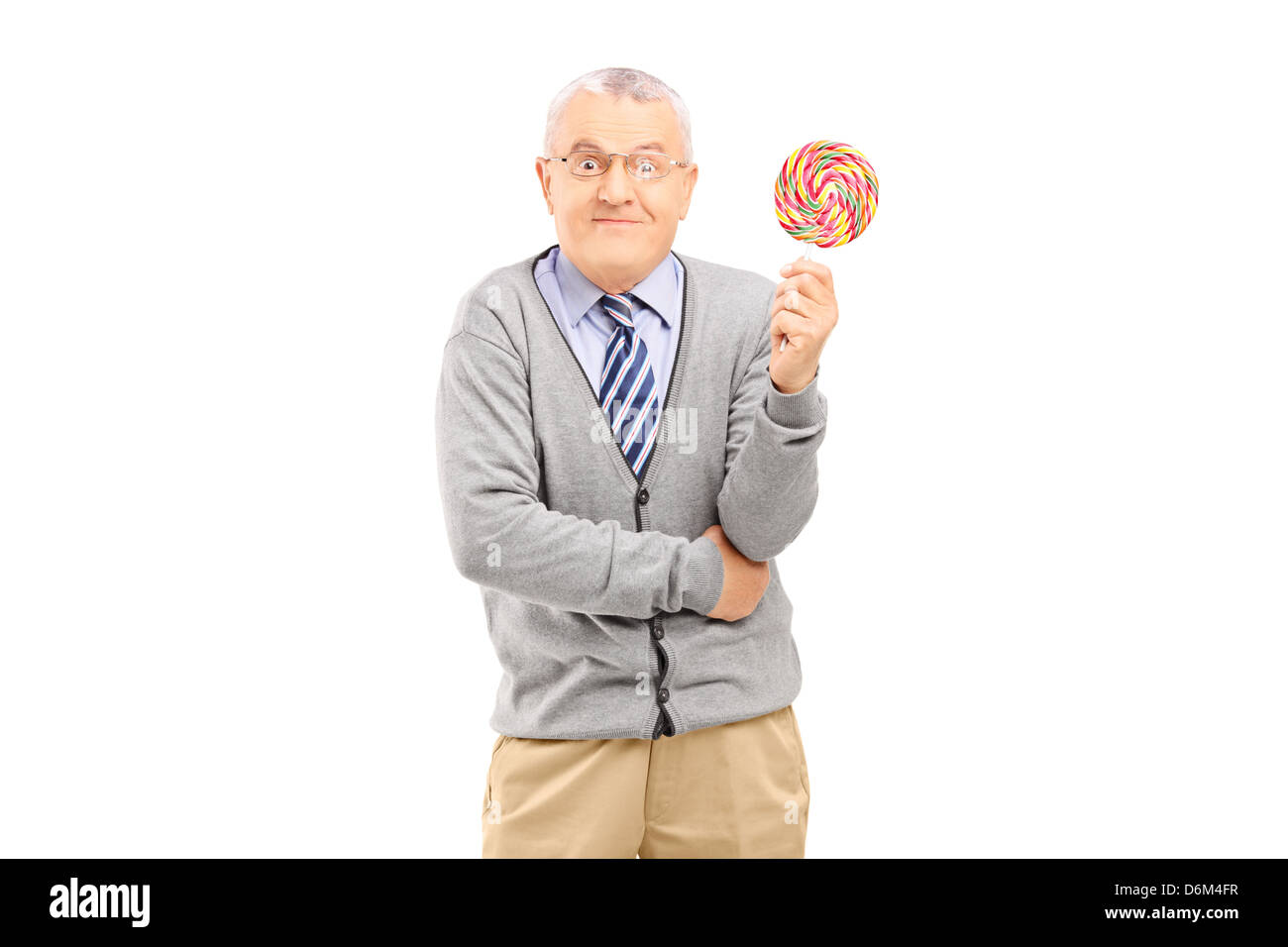 Mature man holding a colorful lollipop, isolated on white background Stock Photo
