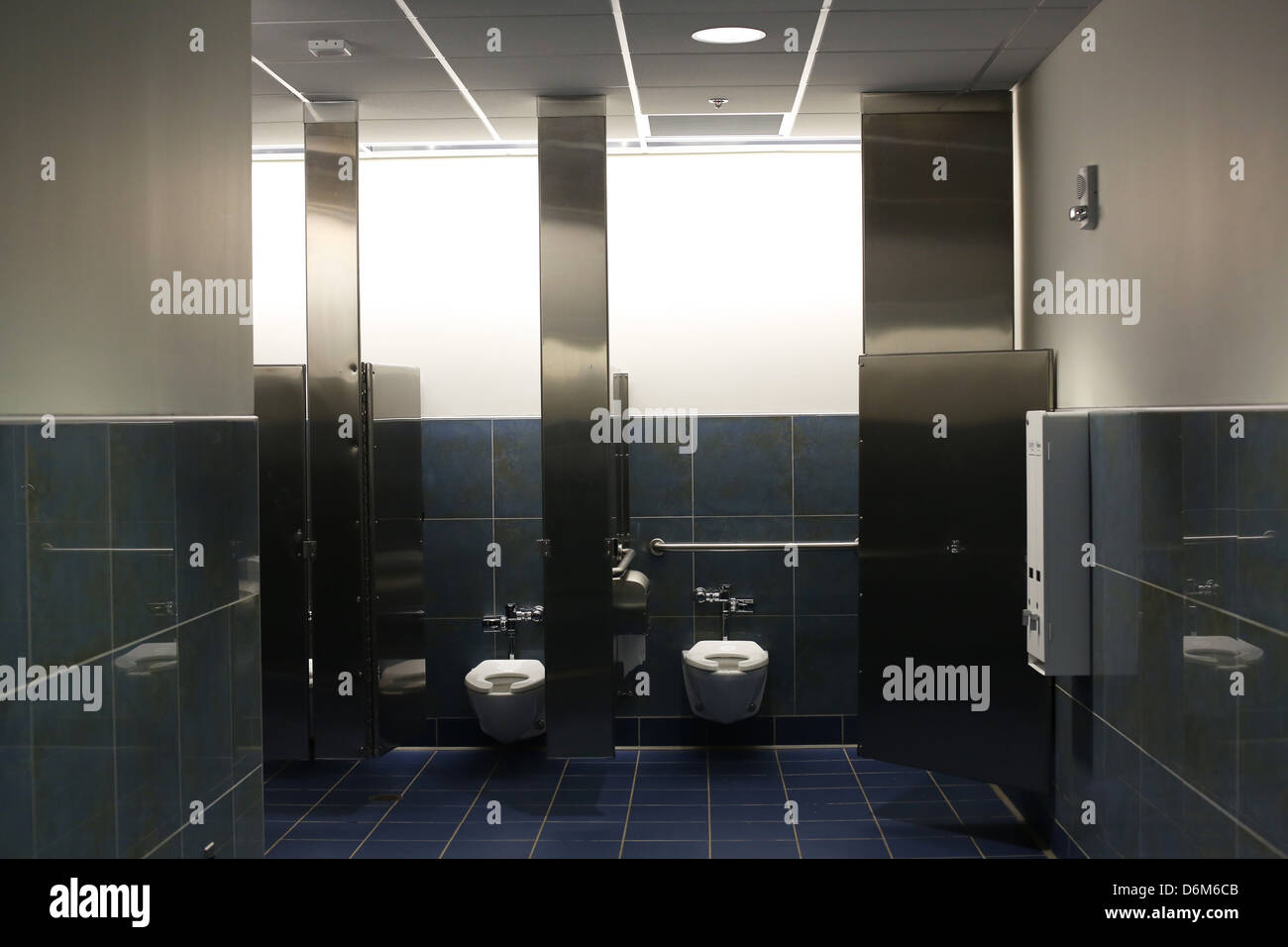 Two stalls of a very clean public restroom. Stock Photo