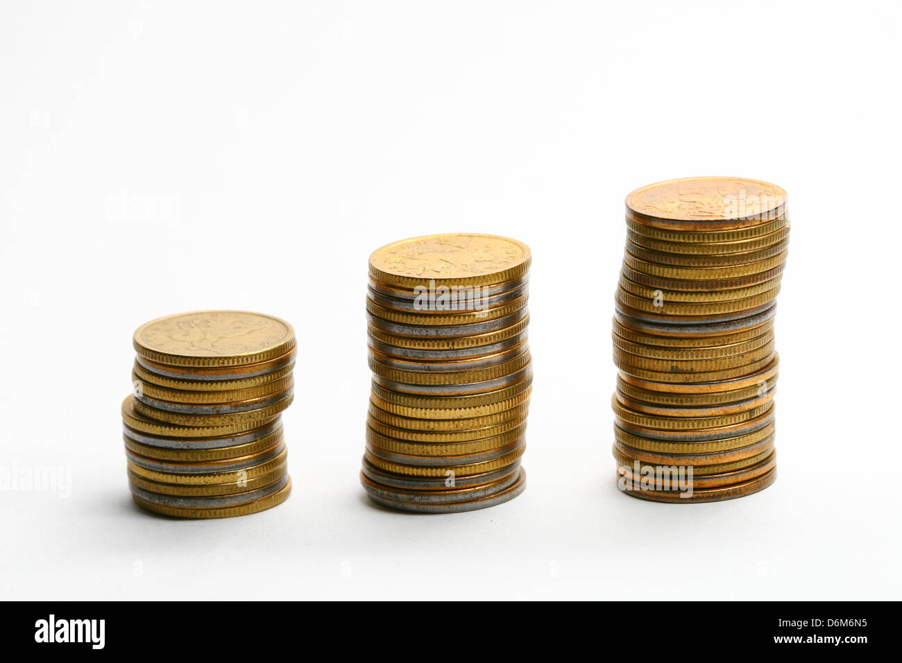 coins piles isolated on white background Stock Photo - Alamy