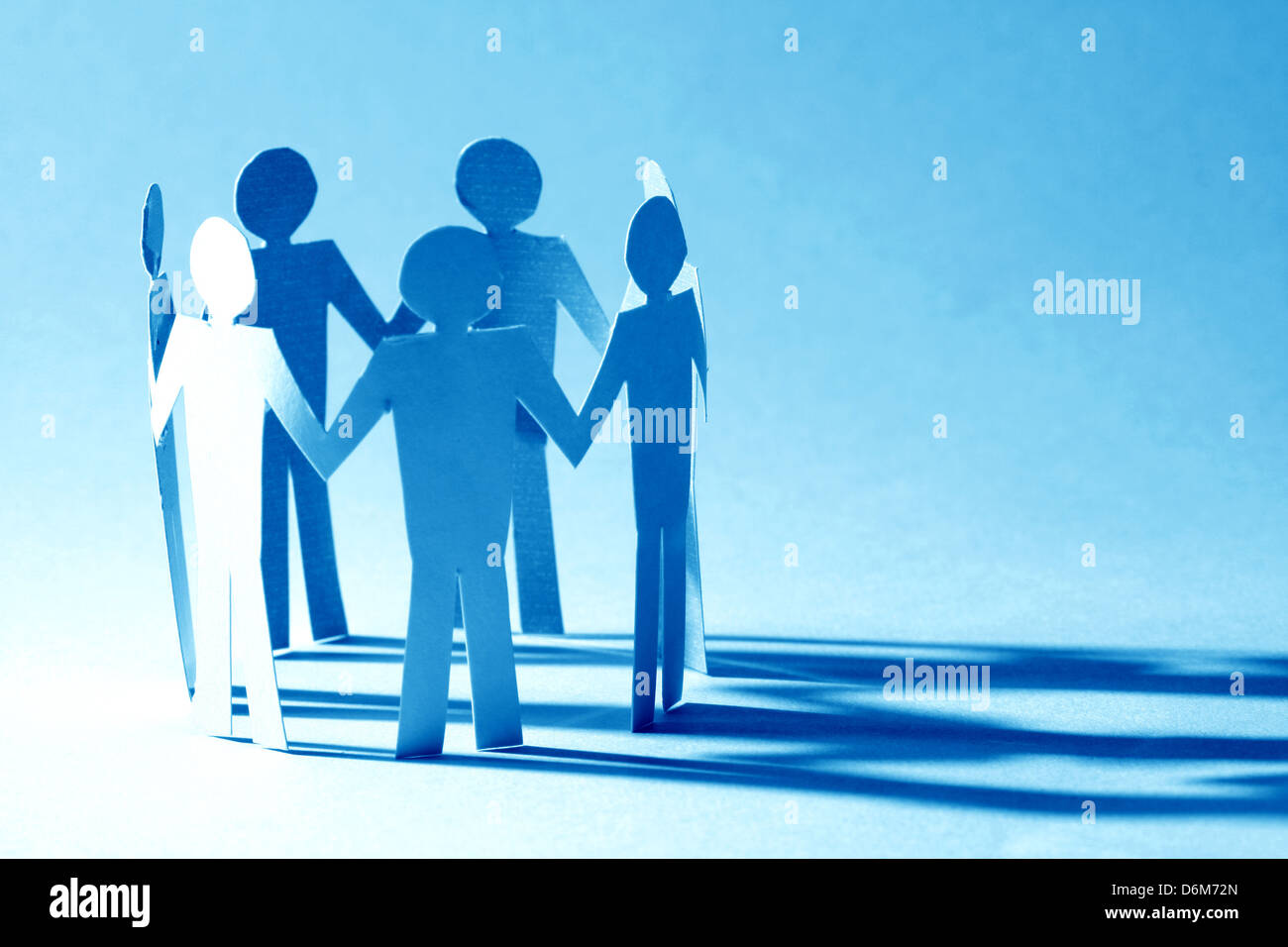 paper team linked together partnership concept Stock Photo