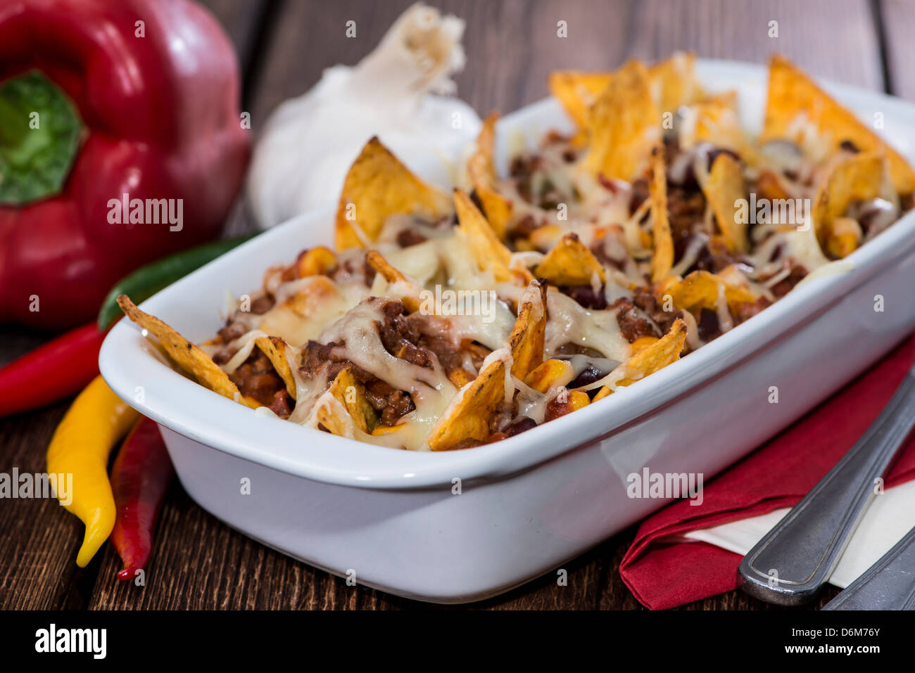 Nacho gratin with Cheese and Chili con Carne Stock Photo - Alamy
