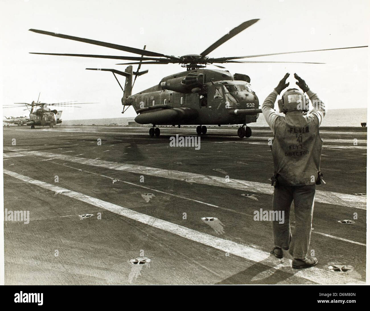 The H-53 is a heavy-lift helicopter used by military forces around the world. This photo captures the H-53 in action, demonstrating its role in transporting large loads and personnel for military and rescue operations. Stock Photo