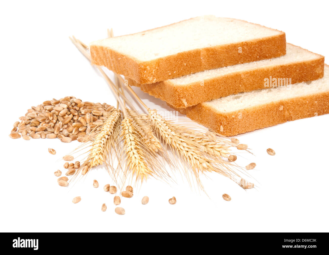 Wheat grains, ears and bread on white bcakground Stock Photo - Alamy