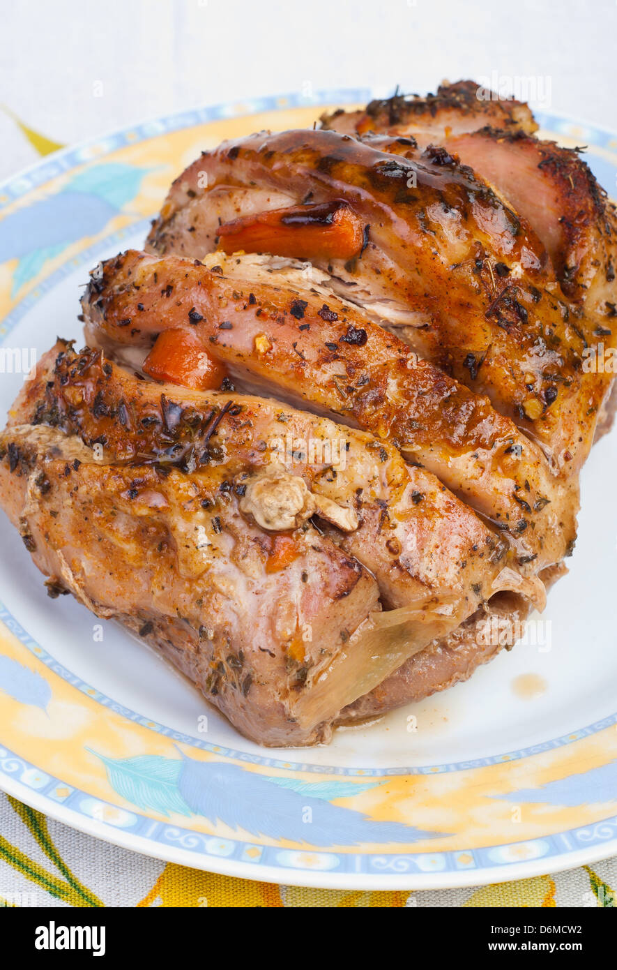 roast of the pork ham with herbs and vegetables Stock Photo