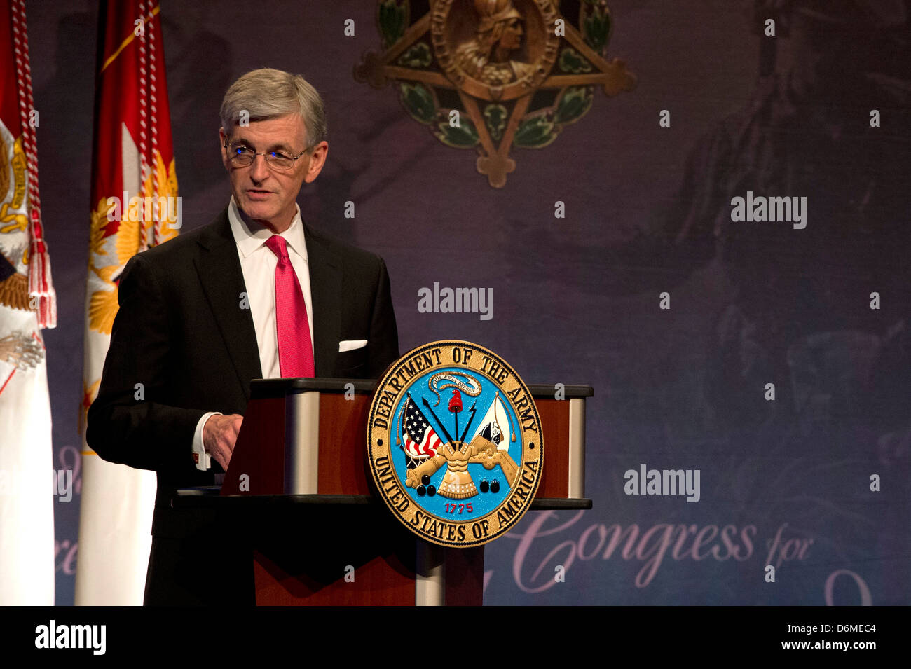 US Secretary of the Army John McHugh speaks during a ceremony inducing Army Chaplain Emil Kapaun posthumously into the Hall of Heroes at the Pentagon April 12, 2013 in Arlington, VA. Stock Photo