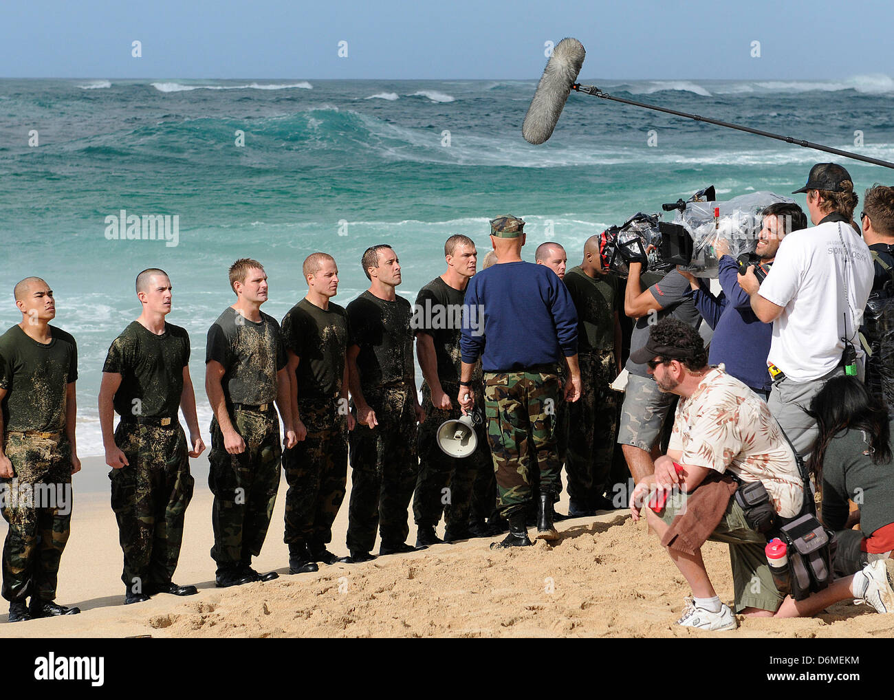 Actors Alex O'Loughlin, Alan Ritchson and Terry O'Quinn along with sailors from Joint Base Pearl Harbor-Hickam simulate Navy SEALS training during filming of the television series CBS's Hawaii Five-0 March 1, 2013 in Haleiwa, Hawaii. Stock Photo