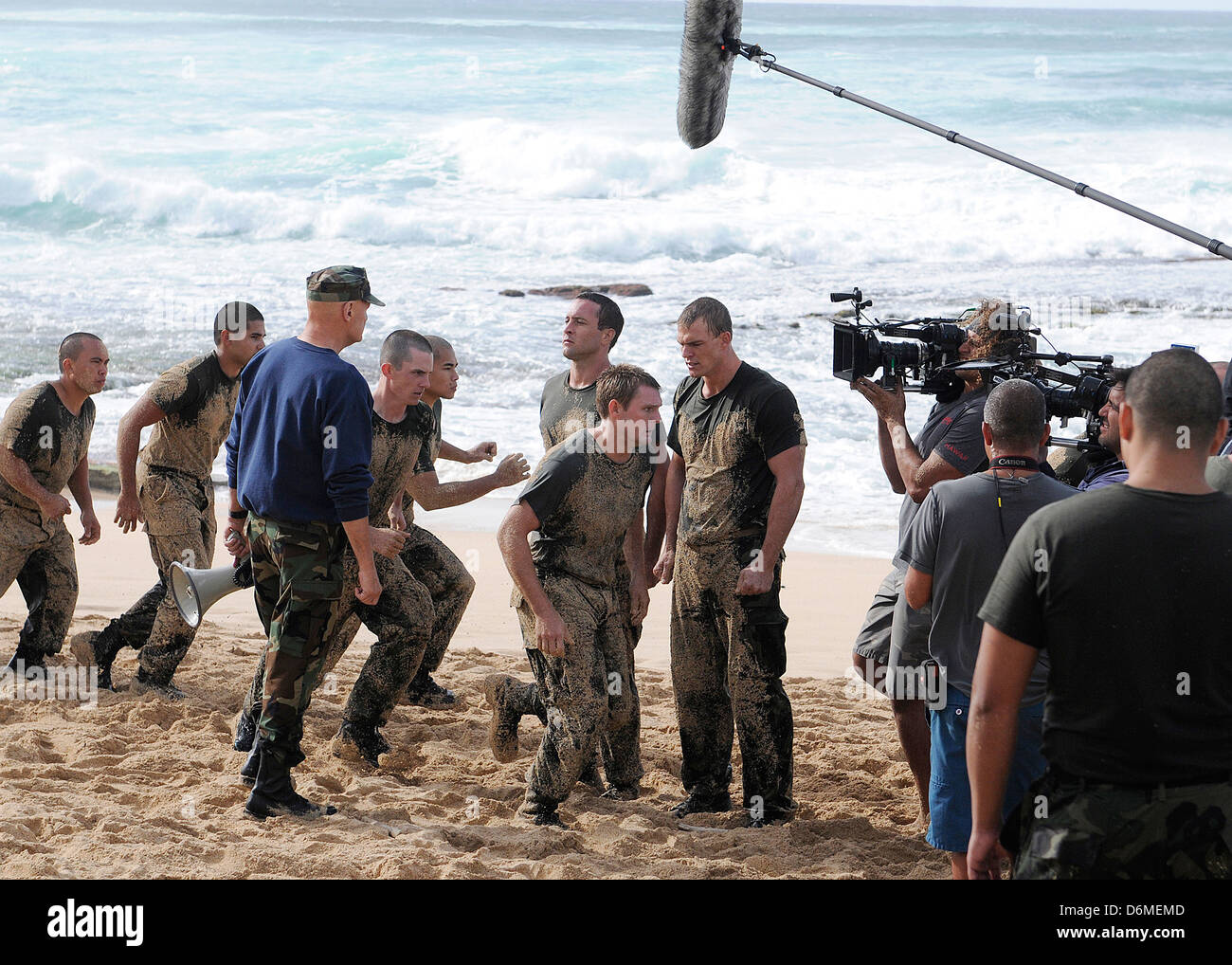 Actors Alex O'Loughlin, Alan Ritchson and Terry O'Quinn along with sailors from Joint Base Pearl Harbor-Hickam simulate Navy SEALS training during filming of the television series CBS's Hawaii Five-0 March 1, 2013 in Haleiwa, Hawaii. Stock Photo