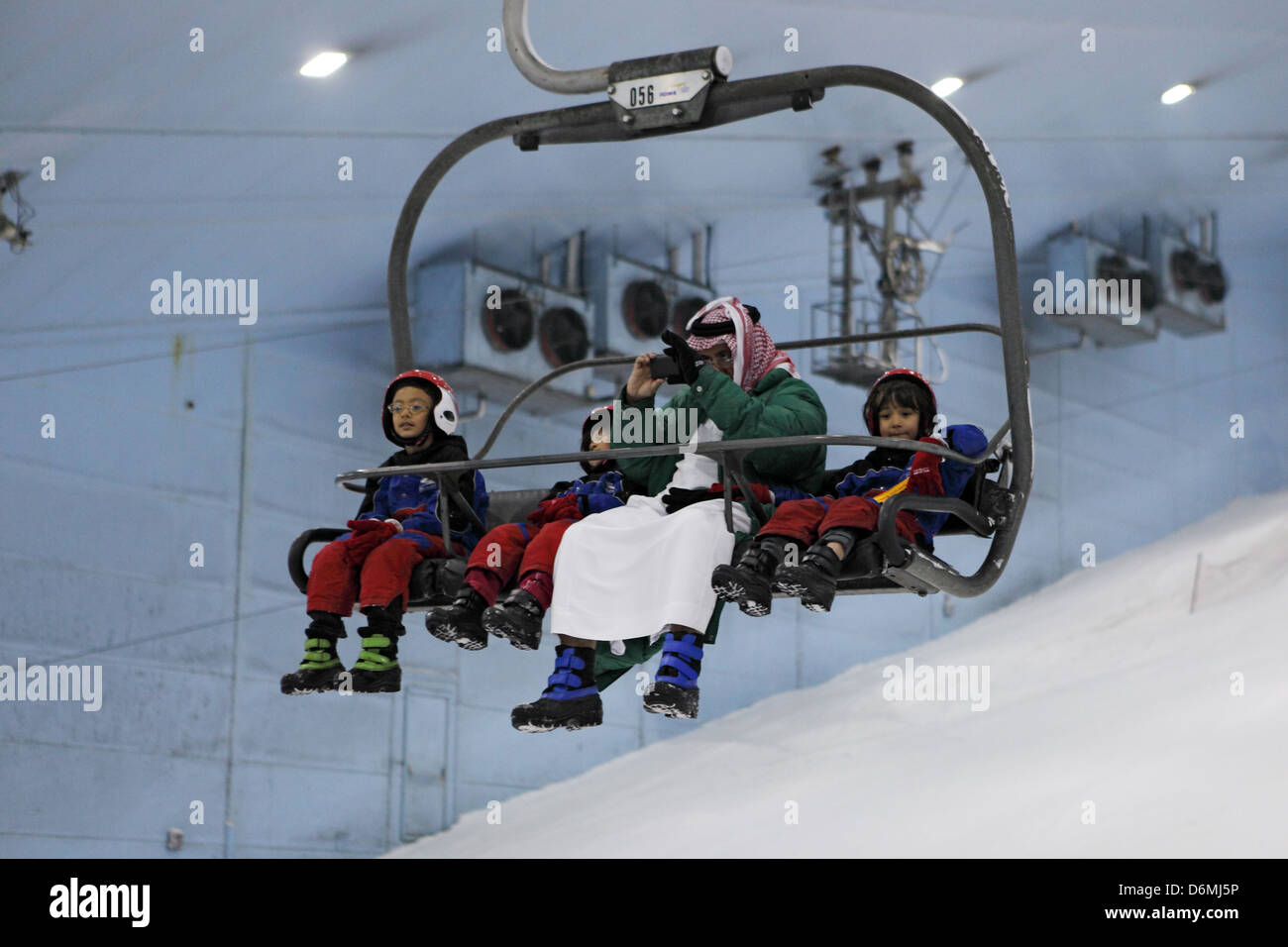 Dubai, United Arab Emirates, father with his children sitting in a