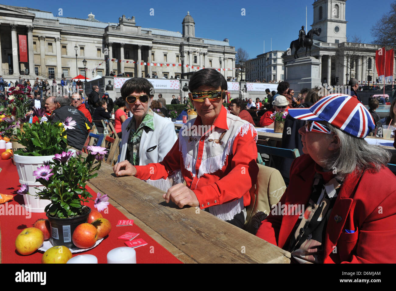 Trafalgar Square, London, UK. 20th April 2013. Two men dressed as Elvis at the Feast of St George. The Feast of St George in Trafalgar Square to celebrate food glorious food. The Mayor of London is inviting Londoners and visitors to a Feast of St George, a celebration of English food, including an English Food Market, a 5 metre Dragon, Jugglers, Jesters and Minstrels to entertain the crowd. Credit: Matthew Chattle/Alamy Live News Stock Photo