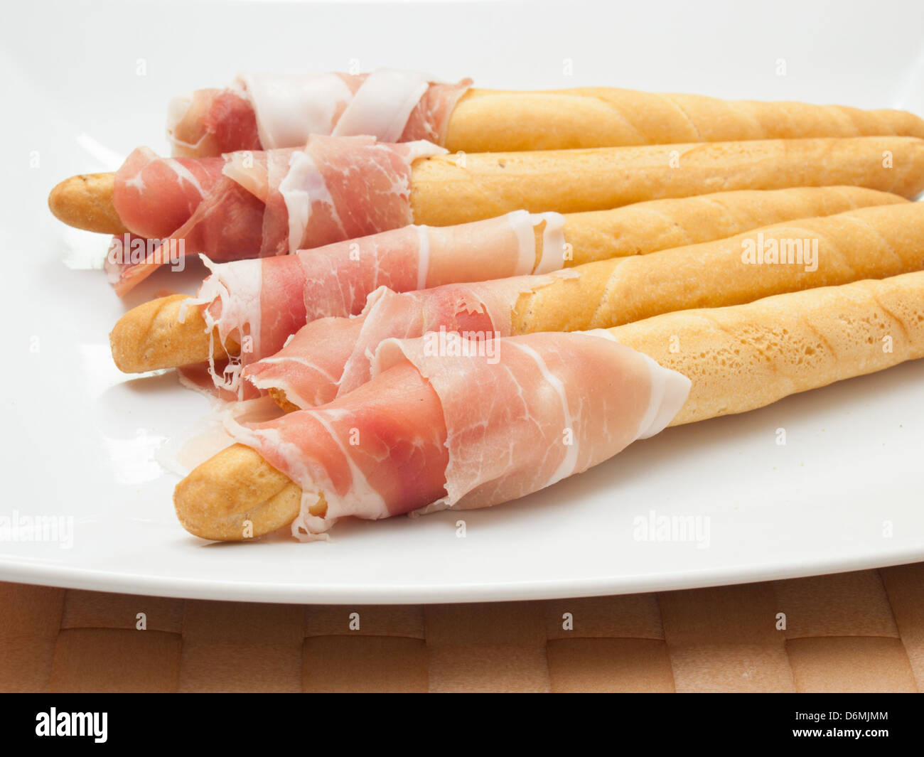 snack with breadsticks and Parma ham Stock Photo