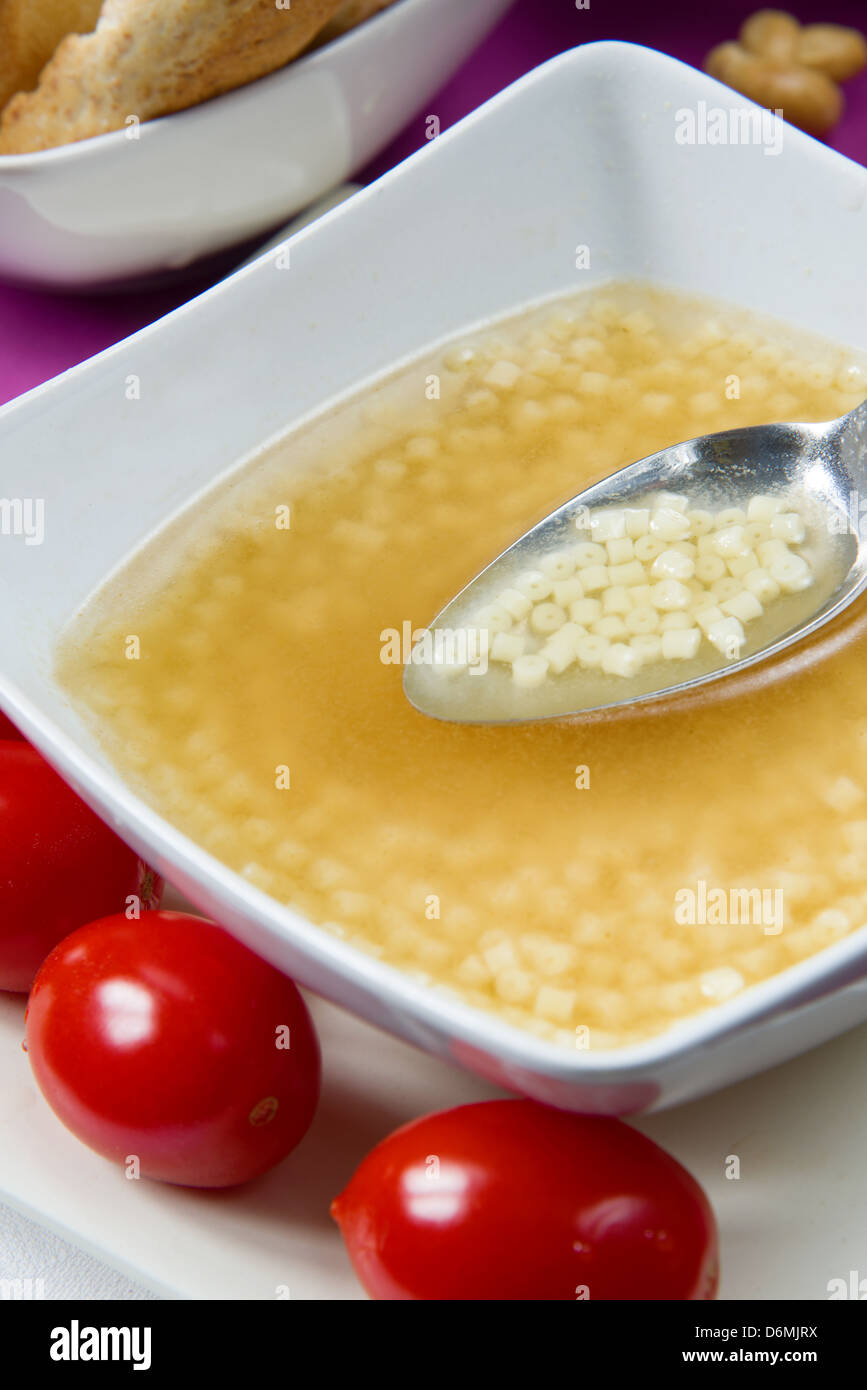 stock cube vegetable broth with small pasta Stock Photo Alamy