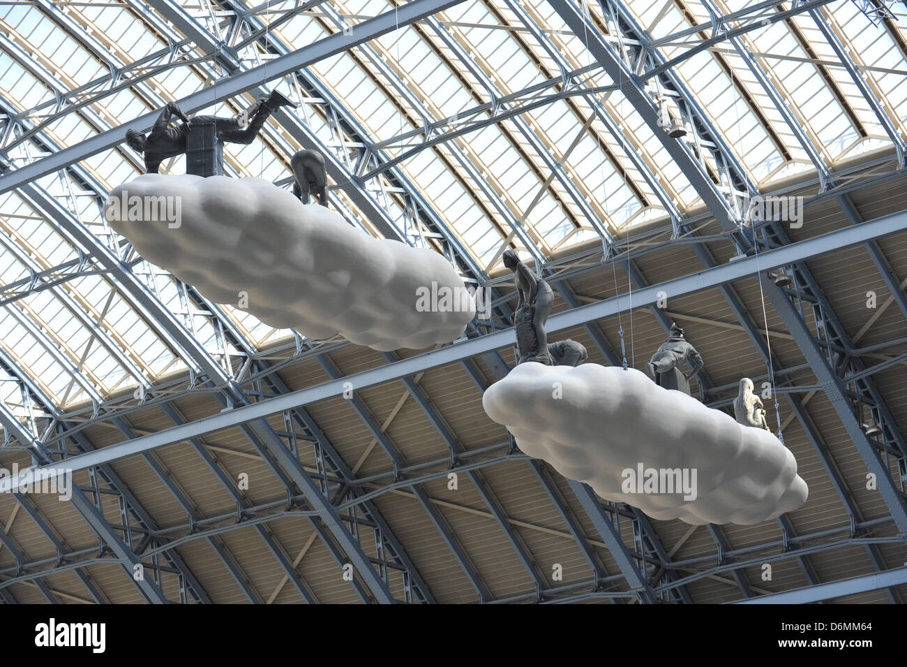 St Pancras Station, London, UK. 20th April 2013.  Cloud: Meteros. A giant 15 metre cloud installation unveiled at St Pancras International station in London. The work, created by husband and wife team Lucy and Jorge Orta, has been placed above the station's Grand Terrace. Cloud: Meteoros is the first artwork in a series of 'Terrace Wires' pieces commissioned by HS1 Ltd for the space - which was home to the Olympic rings last summer. Credit: Matthew Chattle/Alamy Live News Stock Photo