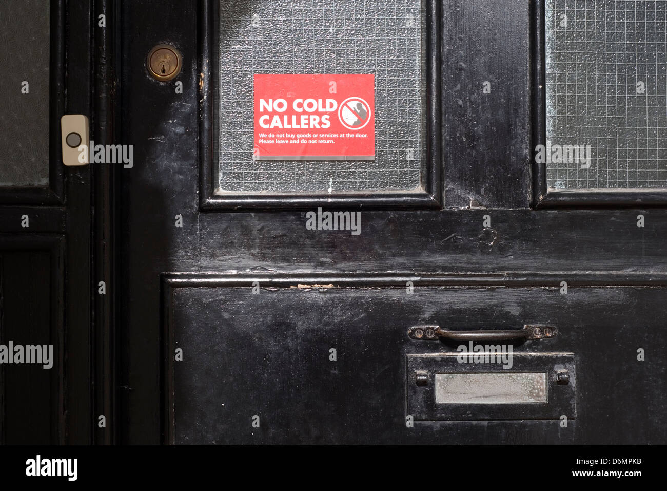 no cold callers sticker placed on a front door Stock Photo
