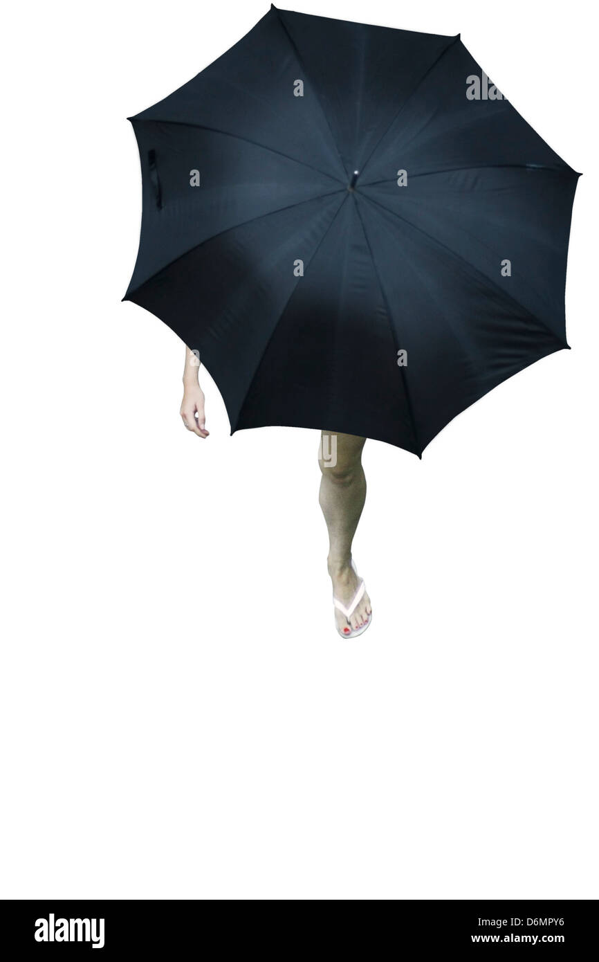 Walking in the rain with an umbrella Stock Photo - Alamy