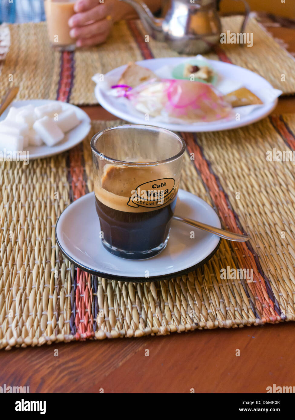 Coffee and petite cakes on table in cafe in Marrakech, Morocco, North