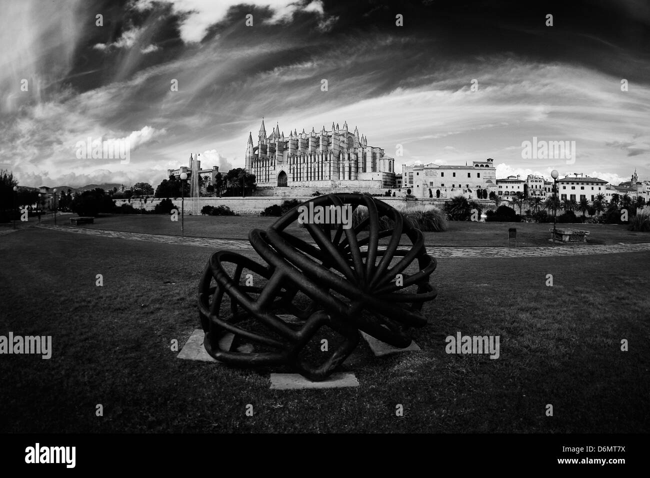 View of Palma de Mallorca´s cathedral next to a Ben Jakober sculpture representing a Football helmet. Stock Photo