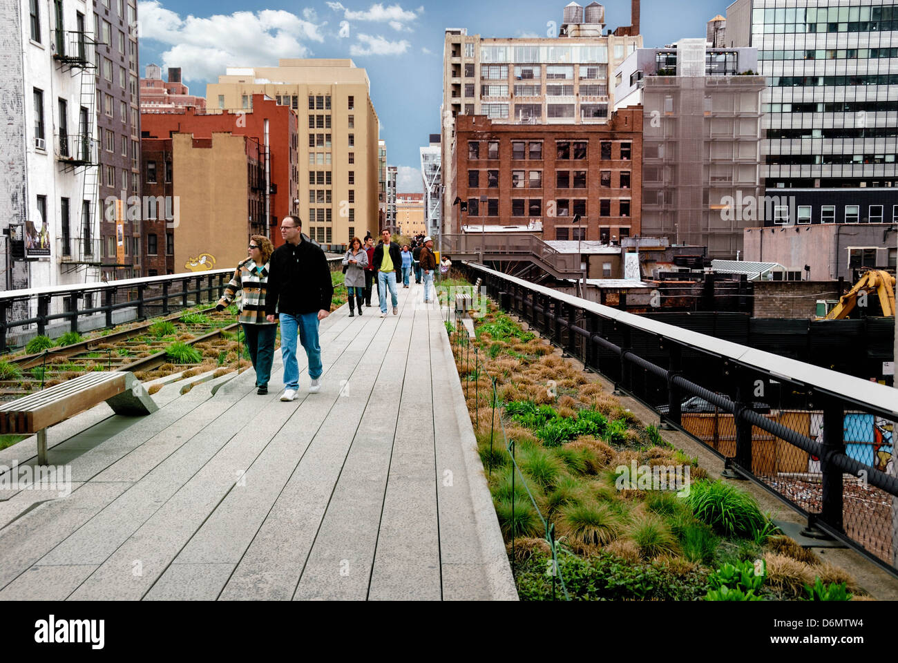 The High Line is a 1-mile New York City linear park built on an elevated former railroad, and is now an aerial greenway. Stock Photo