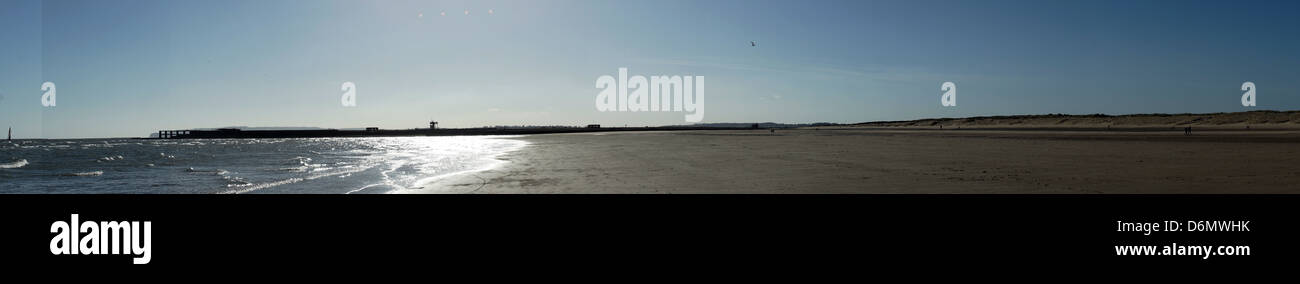 Camber sands water front sand beaches blue sky sunet Stock Photo